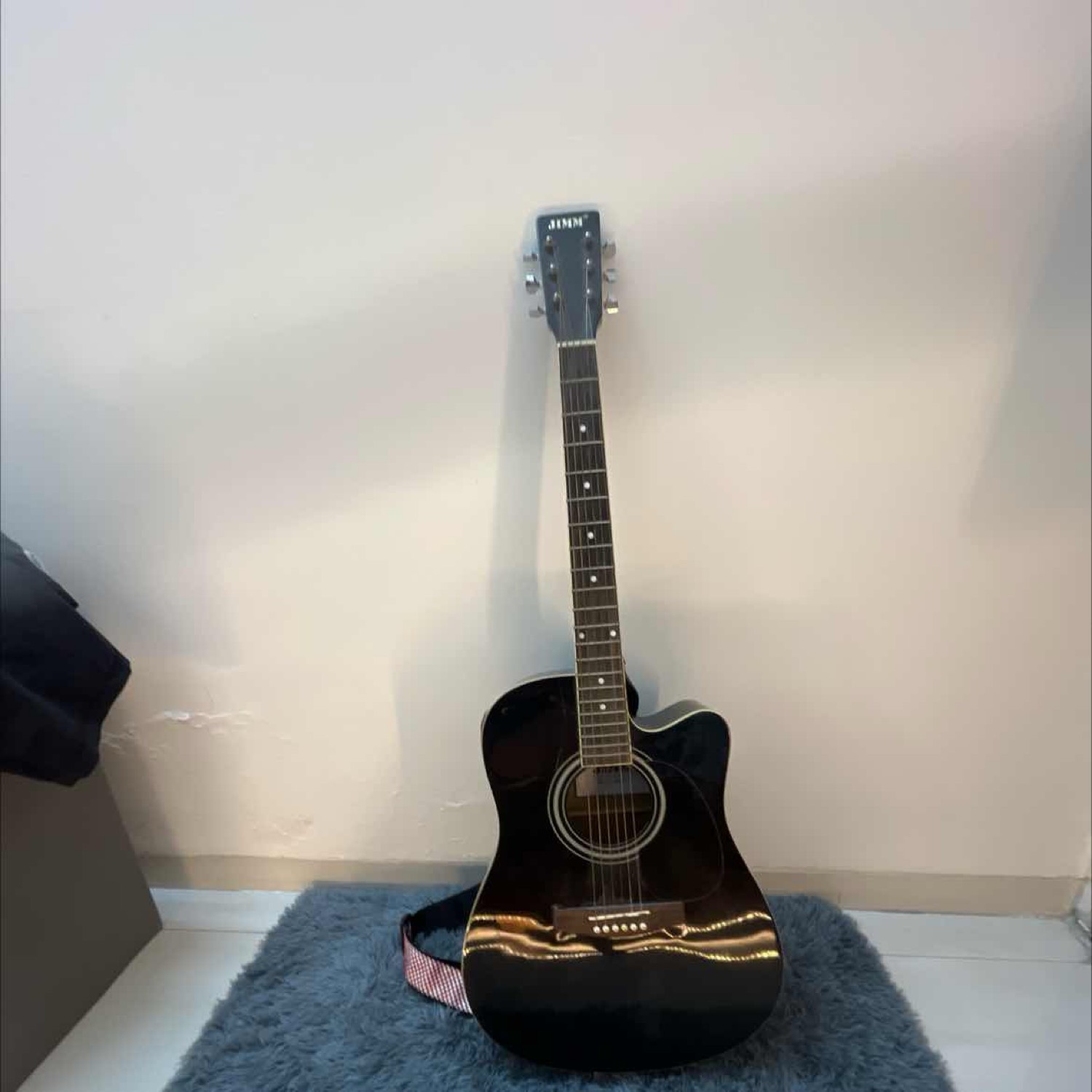 Jimm deals acoustic guitar